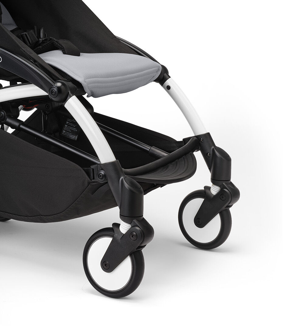 Stokke® YOYO3® 6+ Stone. White Frame. Front wheel suspension. Close-up. galery image 16